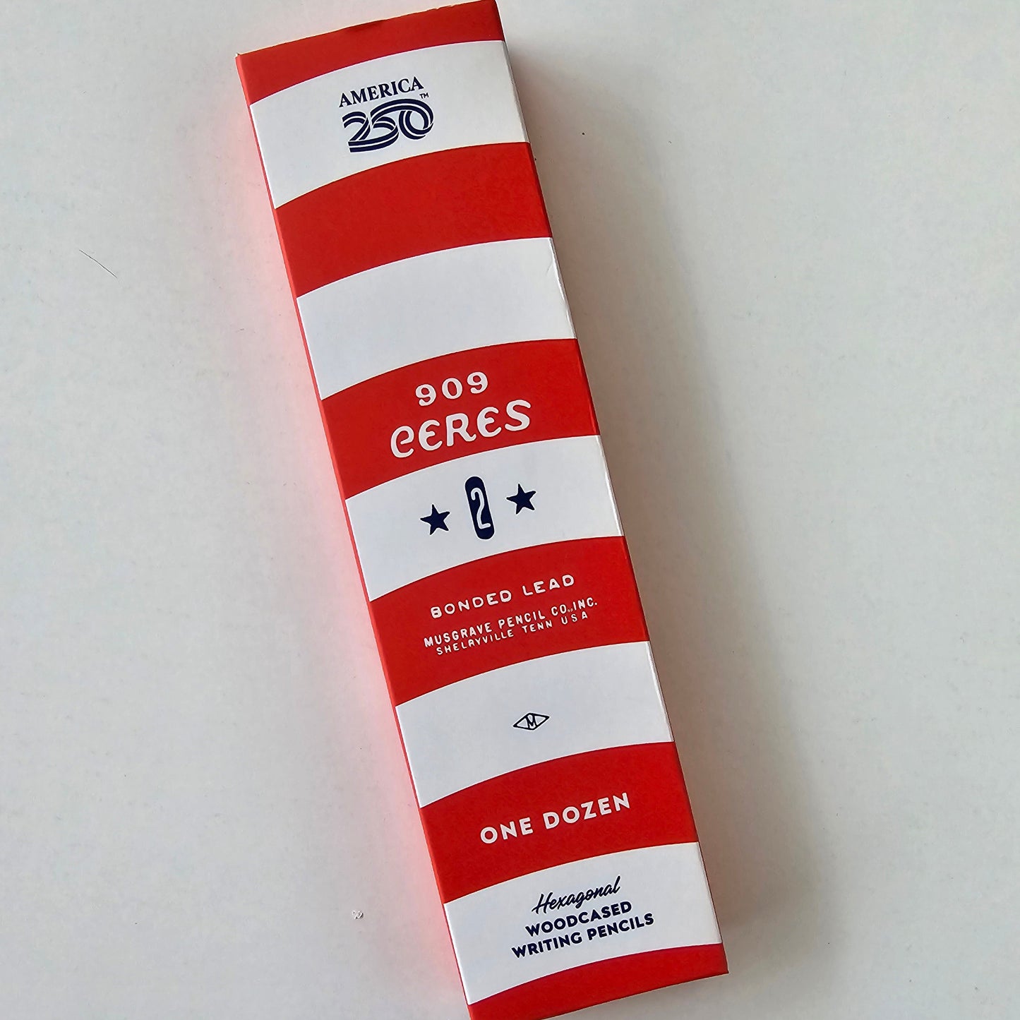 Red and white striped box with text on a light gray background