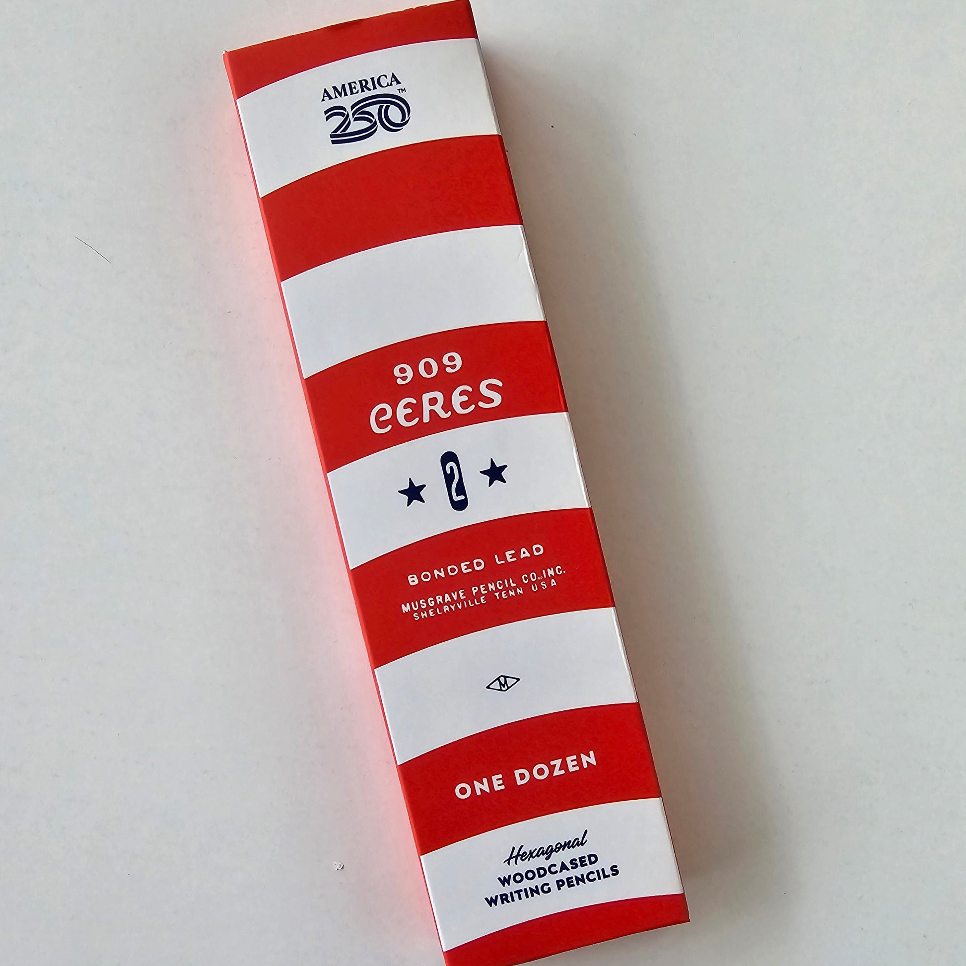 Red and white striped box with text on a light gray background