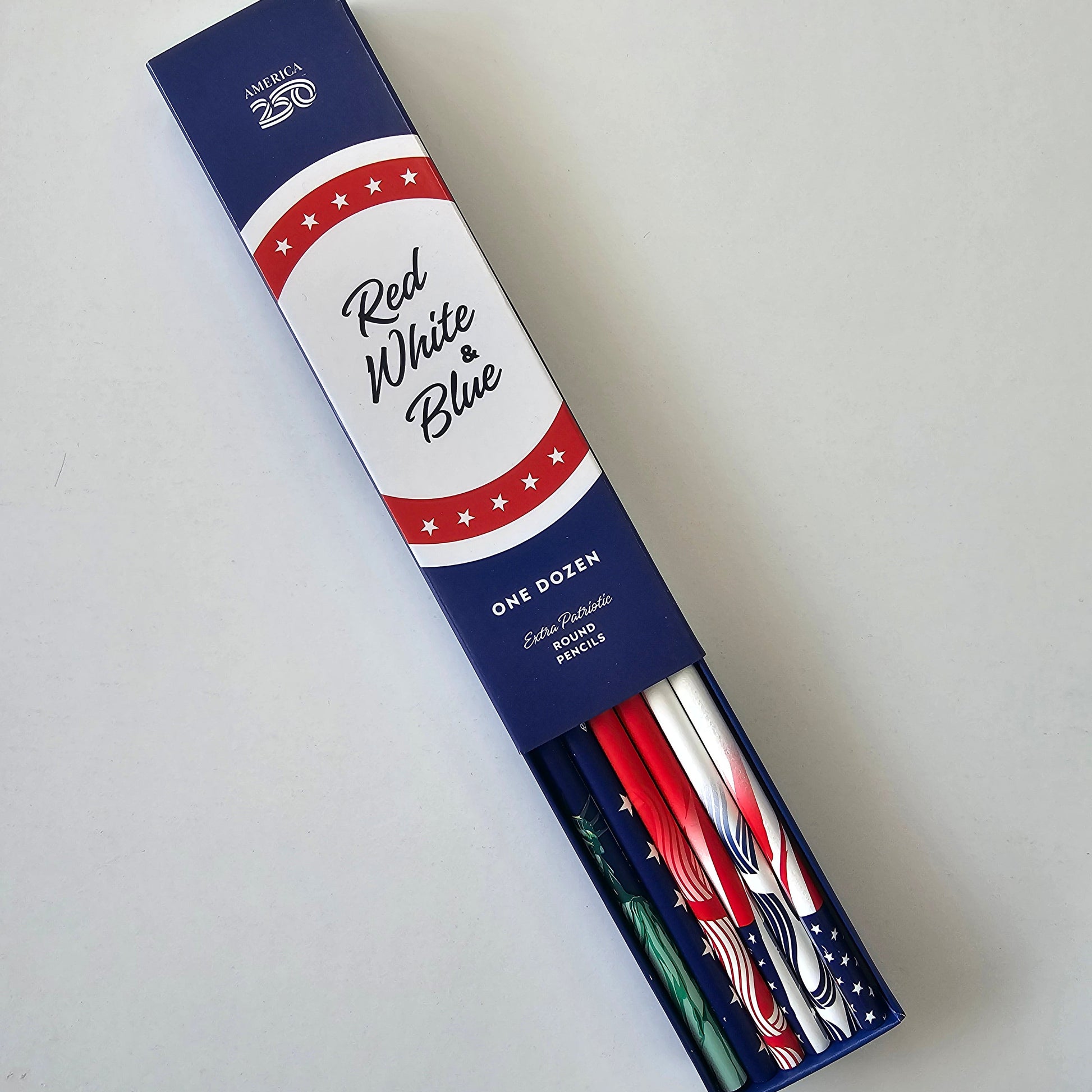 Packaged pencils with red, white, and blue design on a light gray background