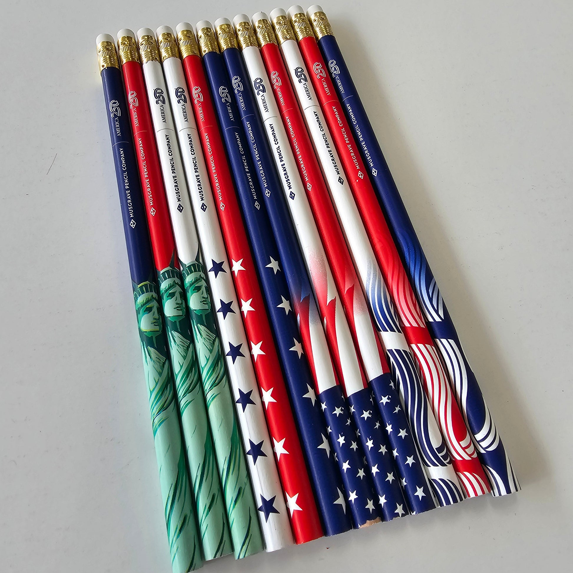 Set of pencils with American flag design on a gray background